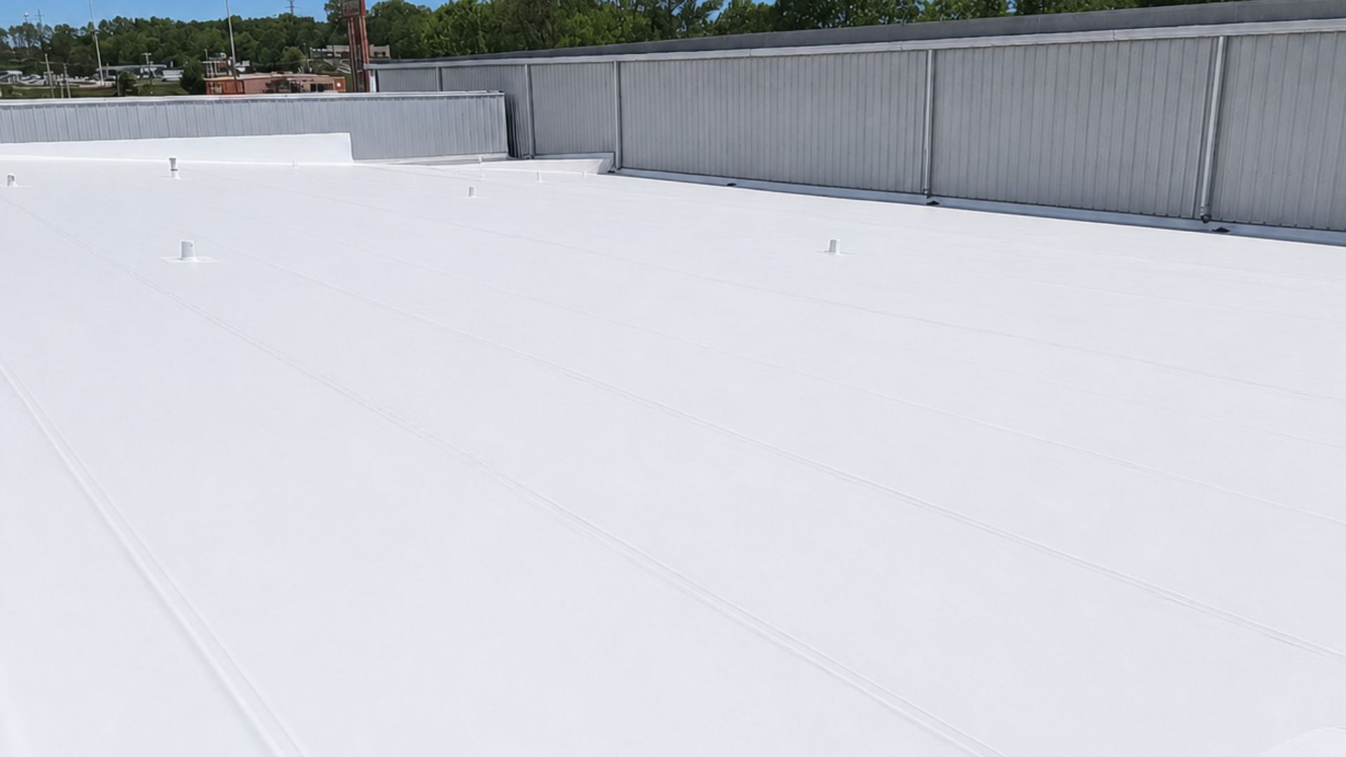 White single-ply commercial membrane roof installed by Exceptional Roofing in Jackson, Mississippi