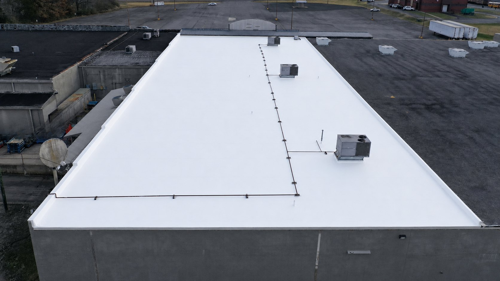Partial commercial flat roof replacement at Benton IGA in Benton, Kentucky by Exceptional Roofing